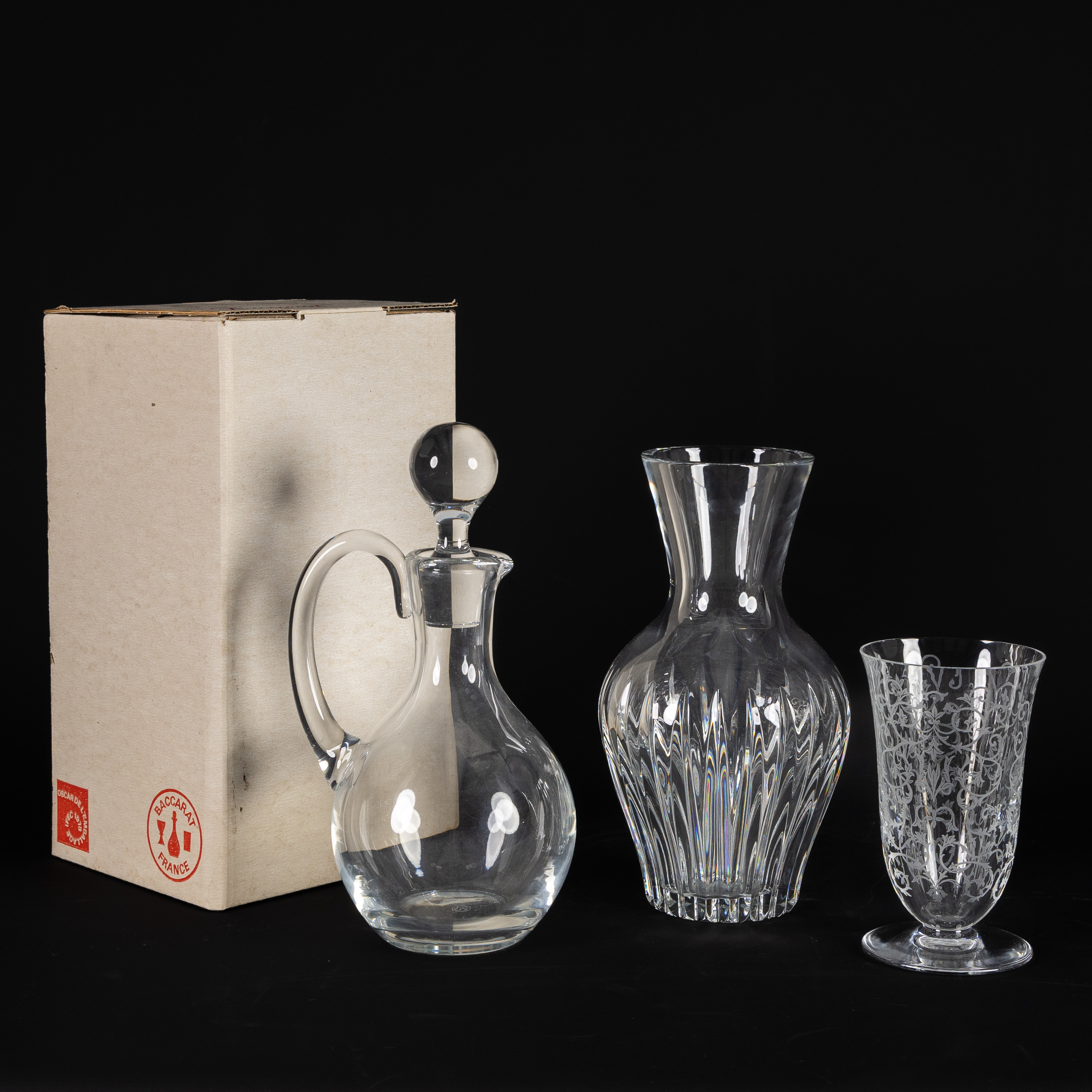Baccarat, a decanter and two vases, 'Decanter', 'Geneviève' and 'Erna', cut and engraved crystal, France, 20th C. (L:14 x H:24.5 cm)